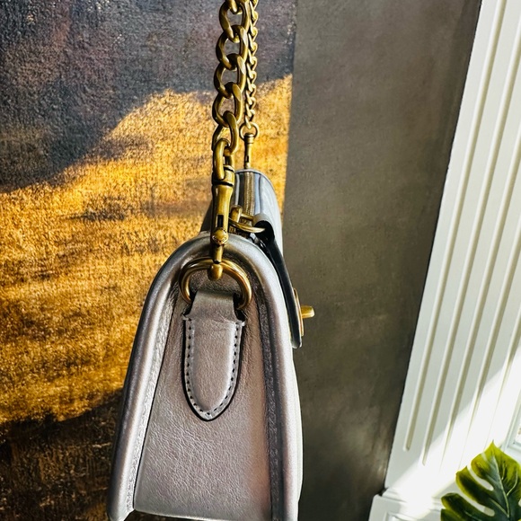 Coach wristlet in silver puffy leather with gold hardware. - Picture 7 of 7